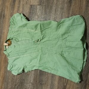 Women's small cotton shirt with side zipper.